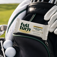 Full Turn energy bar with golf equipment in the background